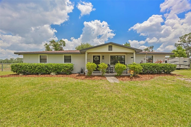 3217 Mott Rd, Dover, FL 33527 - single story home with a front yard, stucco siding, and a porch