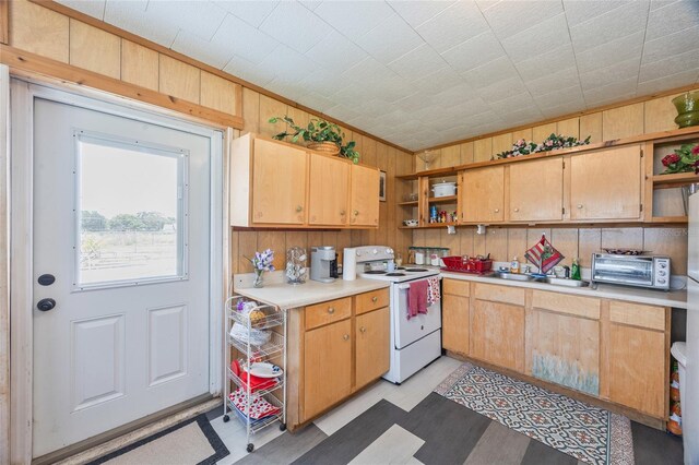 3217 Mott Rd, Dover, FL 33527 - kitchen featuring open shelves, white electric range, wooden walls, light countertops, and a sink
