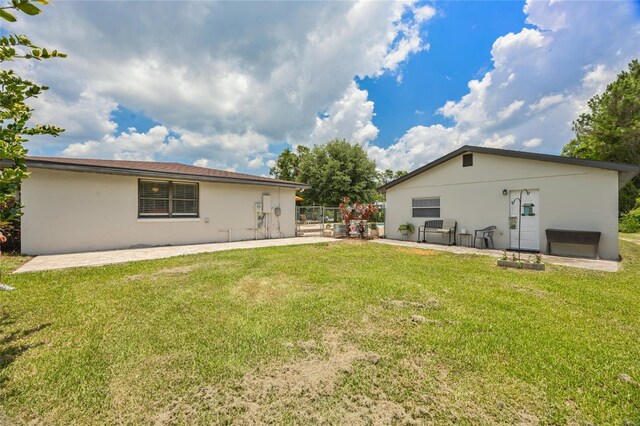 3217 Mott Rd, Dover, FL 33527 - rear view of property featuring stucco siding and a patio