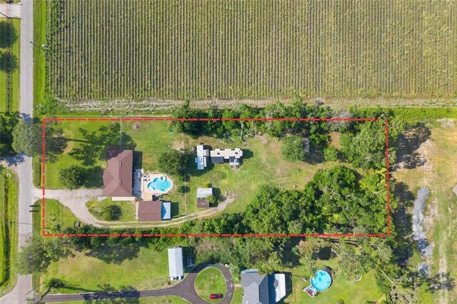 3217 Mott Rd, Dover, FL 33527 - aerial view of property and surrounding area with a pool area, extensive farmland, and property boundaries highlighted