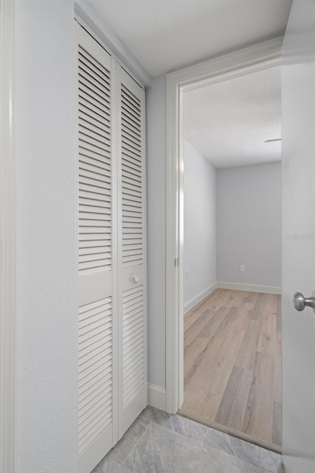500 New York Ave Unit 23, Dunedin, FL 34698 - corridor with baseboards