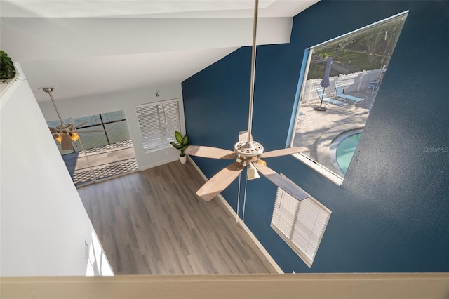 500 New York Ave Unit 23, Dunedin, FL 34698 - detailed view of a ceiling fan, wood finished floors, and baseboards