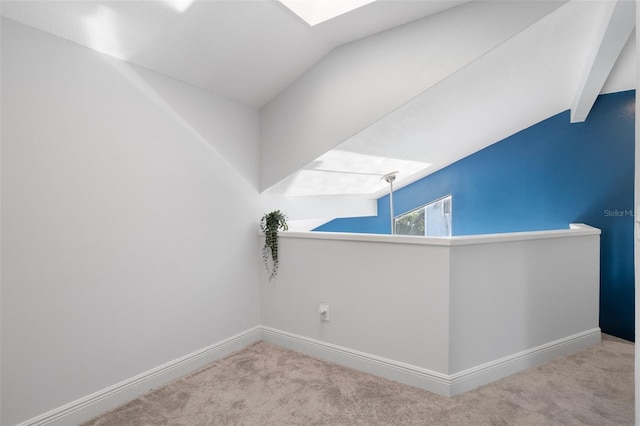 500 New York Ave Unit 23, Dunedin, FL 34698 - bonus room with carpet flooring, baseboards, lofted ceiling, and a skylight