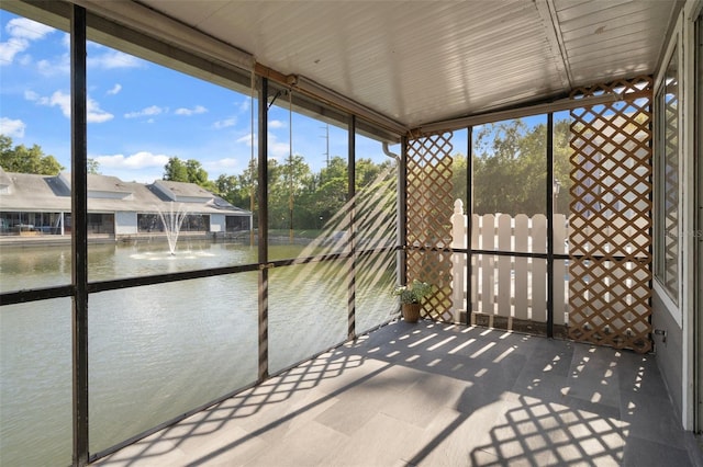 500 New York Ave Unit 23, Dunedin, FL 34698 - unfurnished sunroom with a water view