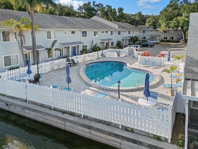 500 New York Ave Unit 23, Dunedin, FL 34698 - community pool with a residential view and a patio