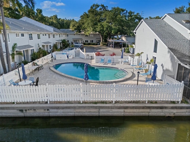 500 New York Ave Unit 23, Dunedin, FL 34698 - community pool featuring a patio and a residential view