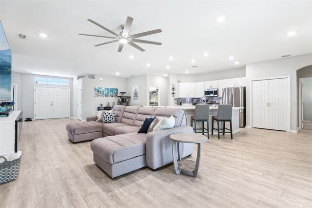 229 St Thomas Dr, Mulberry, FL 33860 - living area with a ceiling fan, light wood-style floors, recessed lighting, and baseboards