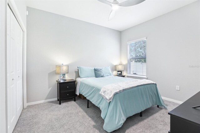 229 St Thomas Dr, Mulberry, FL 33860 - bedroom featuring carpet floors, baseboards, a closet, and a ceiling fan