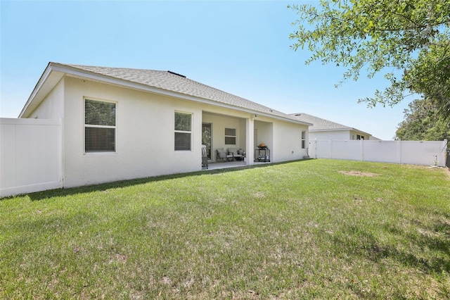 229 St Thomas Dr, Mulberry, FL 33860 - back of property featuring stucco siding, a patio area, and a shingled roof