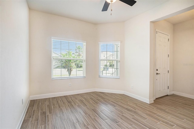 212 Shell Creek Ct, Apollo Beach, FL 33572 - spare room featuring light wood-style floors, a ceiling fan, and baseboards