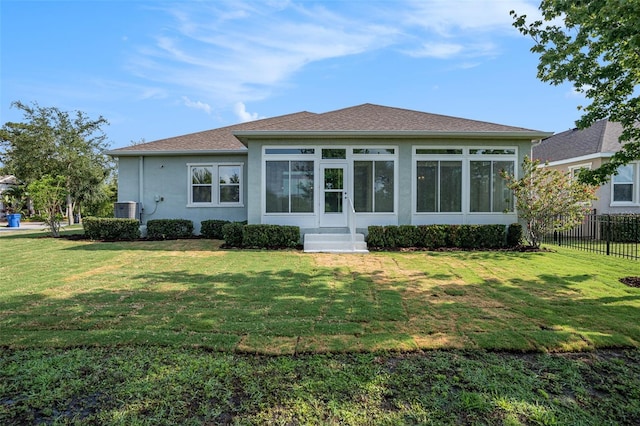 212 Shell Creek Ct, Apollo Beach, FL 33572 - rear view of house with stucco siding, central AC unit, and a sunroom