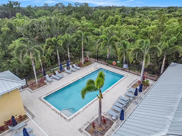 212 Shell Creek Ct, Apollo Beach, FL 33572 - community pool with a wooded view and a patio