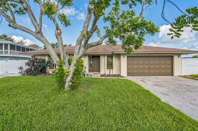 2204 78th St W, Bradenton, FL 34209 - view of front of home with stucco siding, a garage, concrete driveway, and roof with shingles