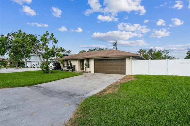 2204 78th St W, Bradenton, FL 34209 - view of front of house featuring an attached garage, stucco siding, and driveway