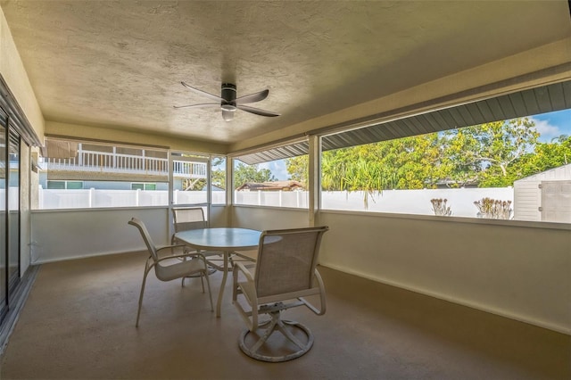 2204 78th St W, Bradenton, FL 34209 - sunroom with ceiling fan, baseboards, a textured ceiling, carpet, and outdoor dining area