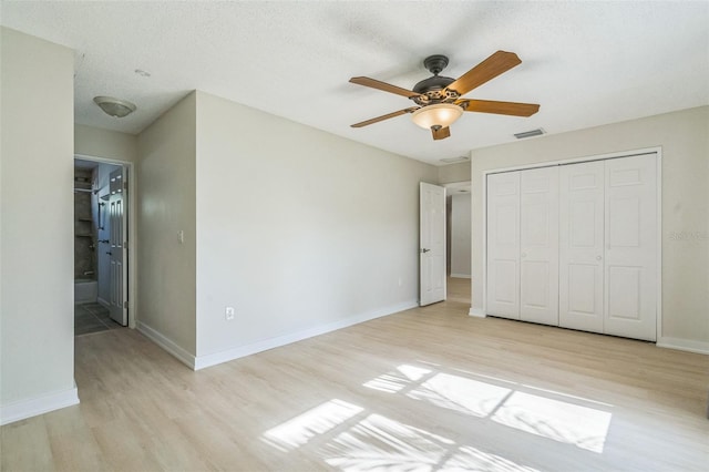 2204 78th St W, Bradenton, FL 34209 - unfurnished bedroom featuring light wood-type flooring, baseboards, a closet, and ceiling fan