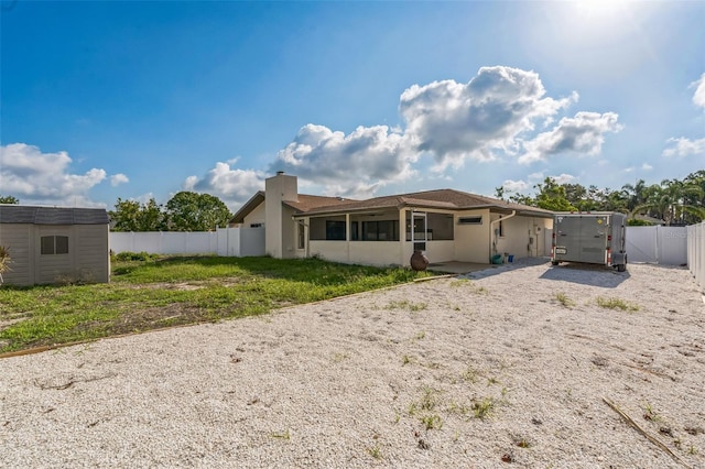 2204 78th St W, Bradenton, FL 34209 - rear view of house with a chimney