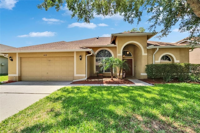 4418 River Overlook Dr, Valrico, FL 33596 - view of front of property with stucco siding, a garage, concrete driveway, and a front lawn