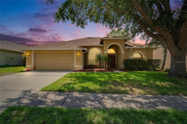 4418 River Overlook Dr, Valrico, FL 33596 - view of front of home featuring stucco siding, an attached garage, concrete driveway, and a front yard