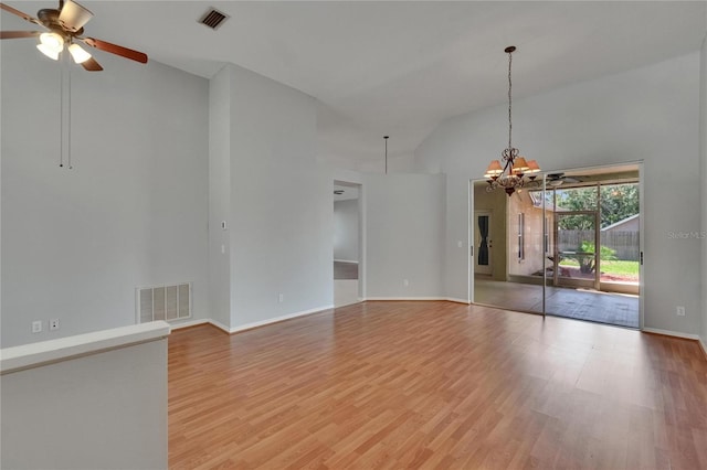 4418 River Overlook Dr, Valrico, FL 33596 - spare room featuring high vaulted ceiling, light wood-style floors, a ceiling fan, baseboards, and a chandelier