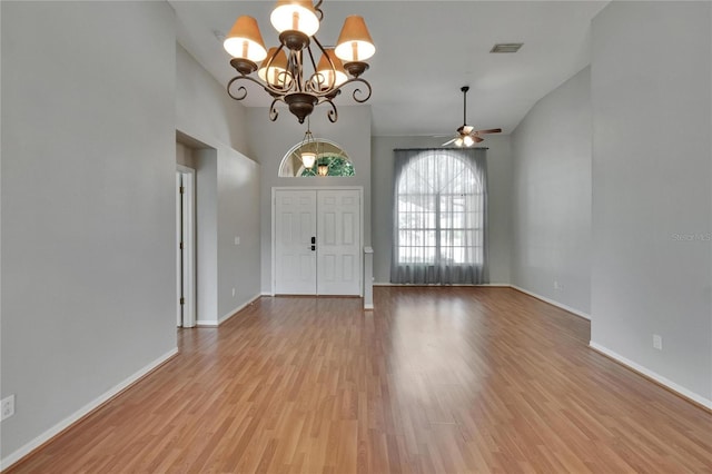 4418 River Overlook Dr, Valrico, FL 33596 - entryway featuring a chandelier, light wood-type flooring, baseboards, ceiling fan, and lofted ceiling