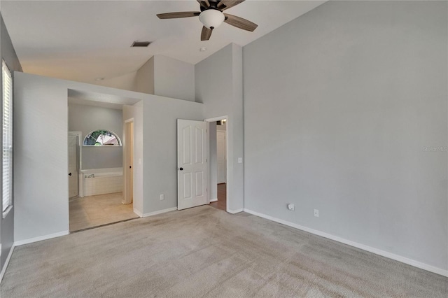 4418 River Overlook Dr, Valrico, FL 33596 - unfurnished bedroom with lofted ceiling, carpet floors, baseboards, ensuite bath, and ceiling fan