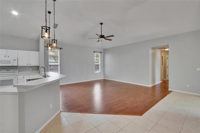 4418 River Overlook Dr, Valrico, FL 33596 - unfurnished living room with a sink, a ceiling fan, light tile patterned flooring, and baseboards