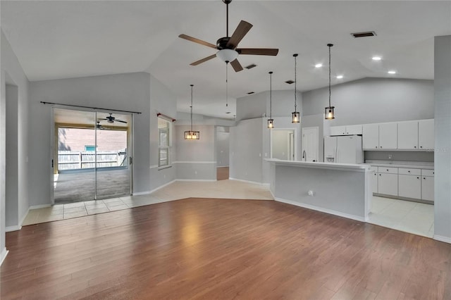 4418 River Overlook Dr, Valrico, FL 33596 - unfurnished living room with ceiling fan, light wood-style flooring, high vaulted ceiling, baseboards, and recessed lighting