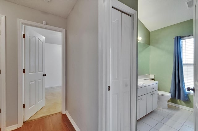 4418 River Overlook Dr, Valrico, FL 33596 - bathroom with vanity, toilet, baseboards, and wood finished floors