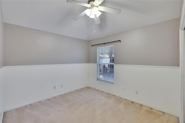 4418 River Overlook Dr, Valrico, FL 33596 - carpeted spare room with a wainscoted wall and a ceiling fan