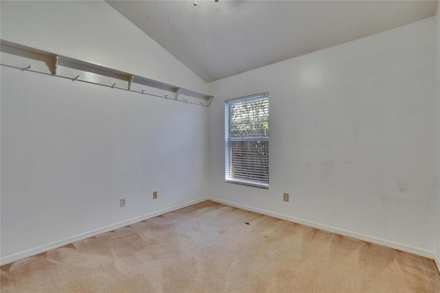 4418 River Overlook Dr, Valrico, FL 33596 - empty room with light carpet, lofted ceiling, and baseboards
