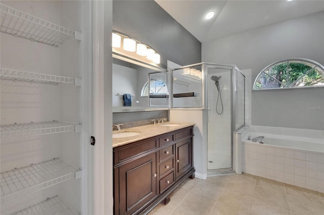 4418 River Overlook Dr, Valrico, FL 33596 - full bathroom featuring a shower stall, double vanity, a garden tub, and tile patterned flooring