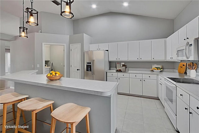 4418 River Overlook Dr, Valrico, FL 33596 - kitchen featuring white appliances, high vaulted ceiling, light tile patterned floors, light countertops, and white cabinetry