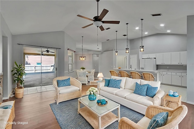 4418 River Overlook Dr, Valrico, FL 33596 - living area featuring ceiling fan, high vaulted ceiling, and light wood-type flooring
