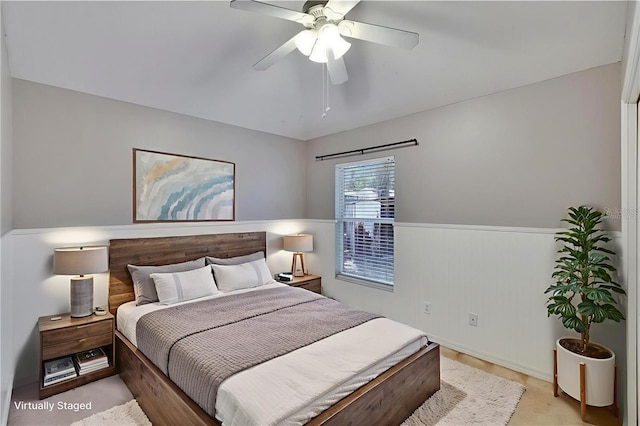 4418 River Overlook Dr, Valrico, FL 33596 - bedroom with a wainscoted wall and a ceiling fan