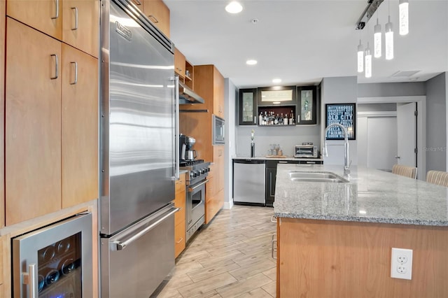 1120 E Kennedy Blvd Unit 1512, Tampa, FL 33602 - kitchen featuring built in appliances, beverage cooler, a sink, a center island with sink, and under cabinet range hood