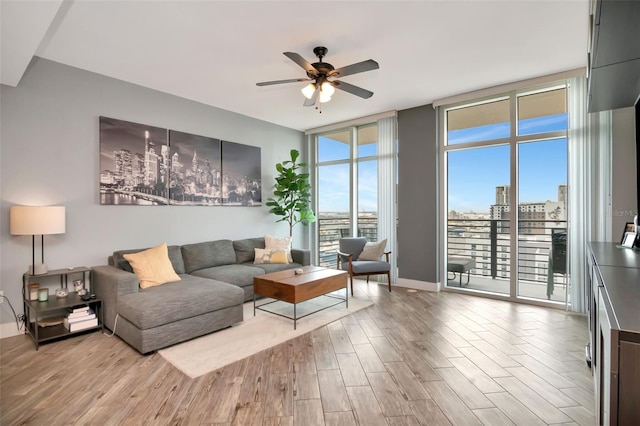 1120 E Kennedy Blvd Unit 1512, Tampa, FL 33602 - living area with a ceiling fan, wood finished floors, expansive windows, and baseboards