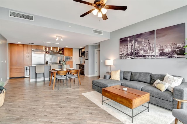 1120 E Kennedy Blvd Unit 1512, Tampa, FL 33602 - living area with a ceiling fan, light wood-type flooring, recessed lighting, and baseboards