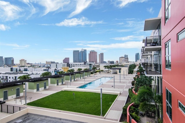1120 E Kennedy Blvd Unit 1512, Tampa, FL 33602 - community pool featuring a view of skyline and a lawn