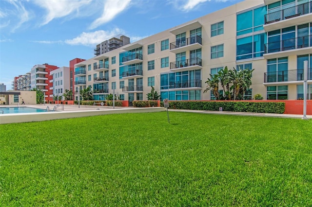 1120 E Kennedy Blvd Unit 1512, Tampa, FL 33602 - view of building exterior featuring a community pool