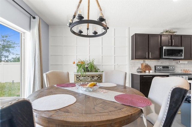 30936 Summer Sun Loop, Wesley Chapel, FL 33545 - dining space featuring a chandelier