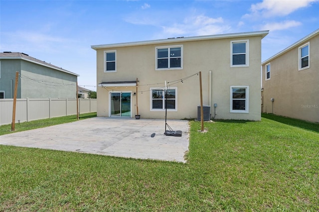 30936 Summer Sun Loop, Wesley Chapel, FL 33545 - back of property with stucco siding, a patio, and cooling unit