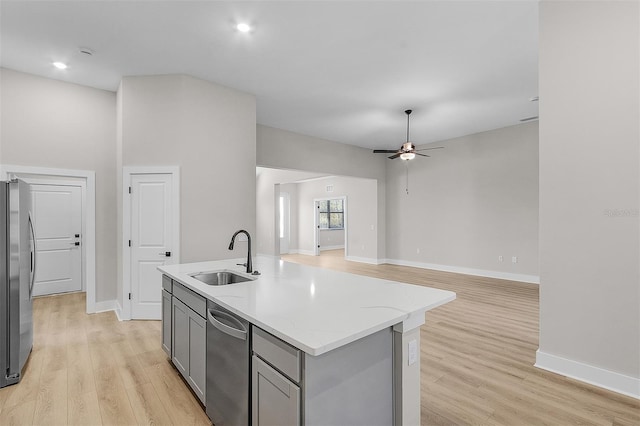 2402 Hiers Rd, Dover, FL 33527 - kitchen with a sink, gray cabinetry, appliances with stainless steel finishes, light wood-style flooring, and recessed lighting