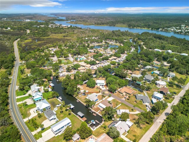 11290 W Coral Ct, Crystal River, FL 34429 - aerial view of property and surrounding area featuring a large body of water, nearby suburban area, and a heavily wooded area