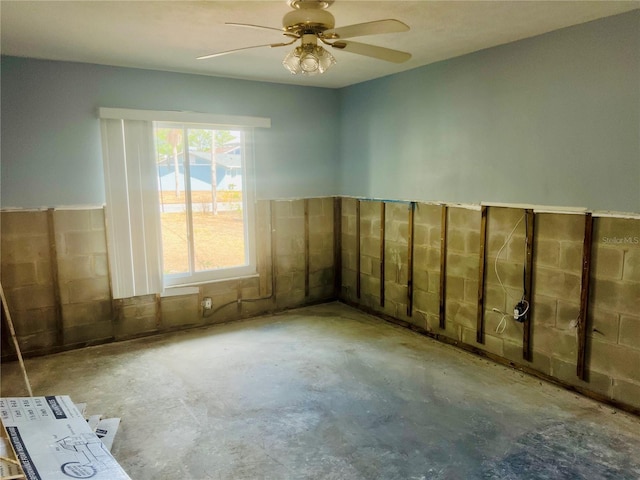 11290 W Coral Ct, Crystal River, FL 34429 - empty room with unfinished concrete floors and a ceiling fan