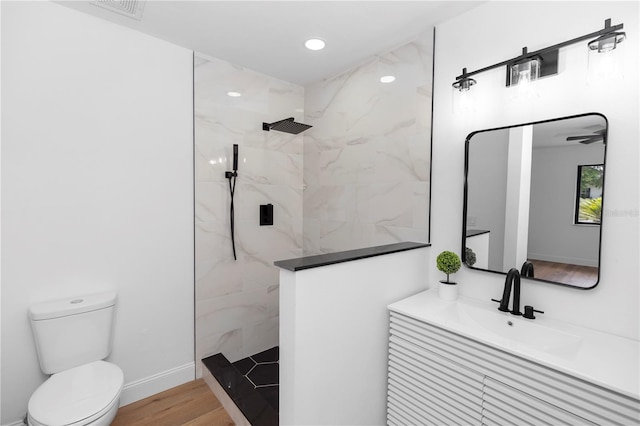1161 Orangewood Ave, Deland, FL 32724 - bathroom featuring a marble finish shower, toilet, vanity, and wood finished floors