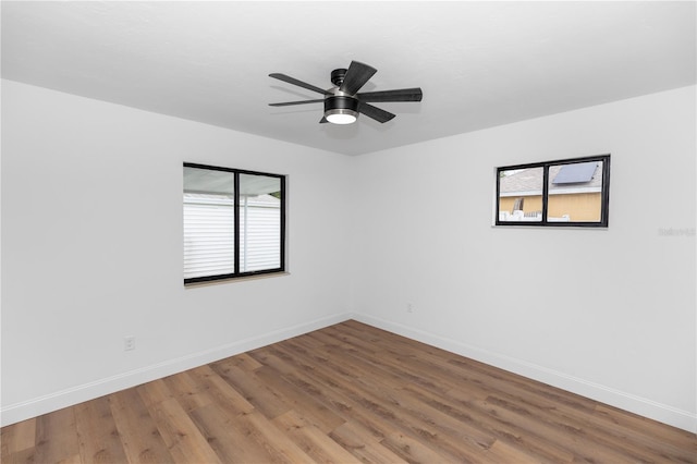 1161 Orangewood Ave, Deland, FL 32724 - spare room featuring wood finished floors, baseboards, and ceiling fan