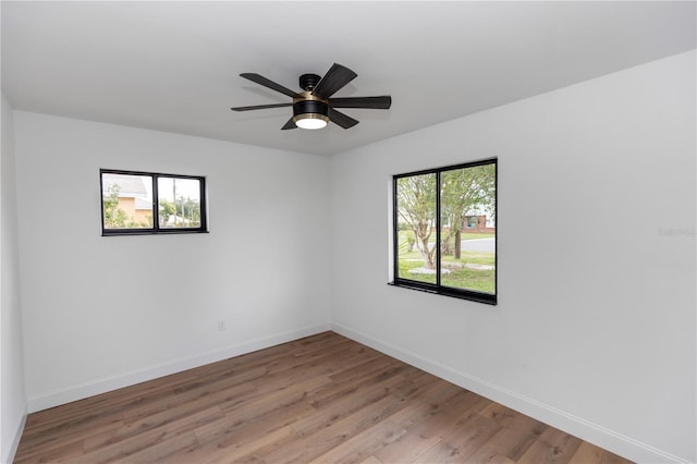 1161 Orangewood Ave, Deland, FL 32724 - empty room featuring light wood-style flooring, baseboards, and a ceiling fan