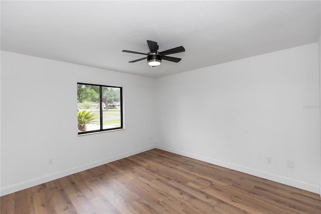 1161 Orangewood Ave, Deland, FL 32724 - empty room featuring wood finished floors, baseboards, and a ceiling fan
