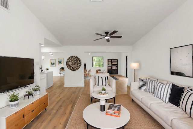 1161 Orangewood Ave, Deland, FL 32724 - living area with light wood finished floors, ceiling fan, and lofted ceiling